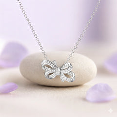 Rhodium Plated Silver Bow Pendant with Sparkling CZ Stones
